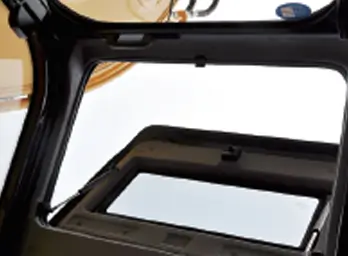 excavator cab is equipped with an openable roof hatch